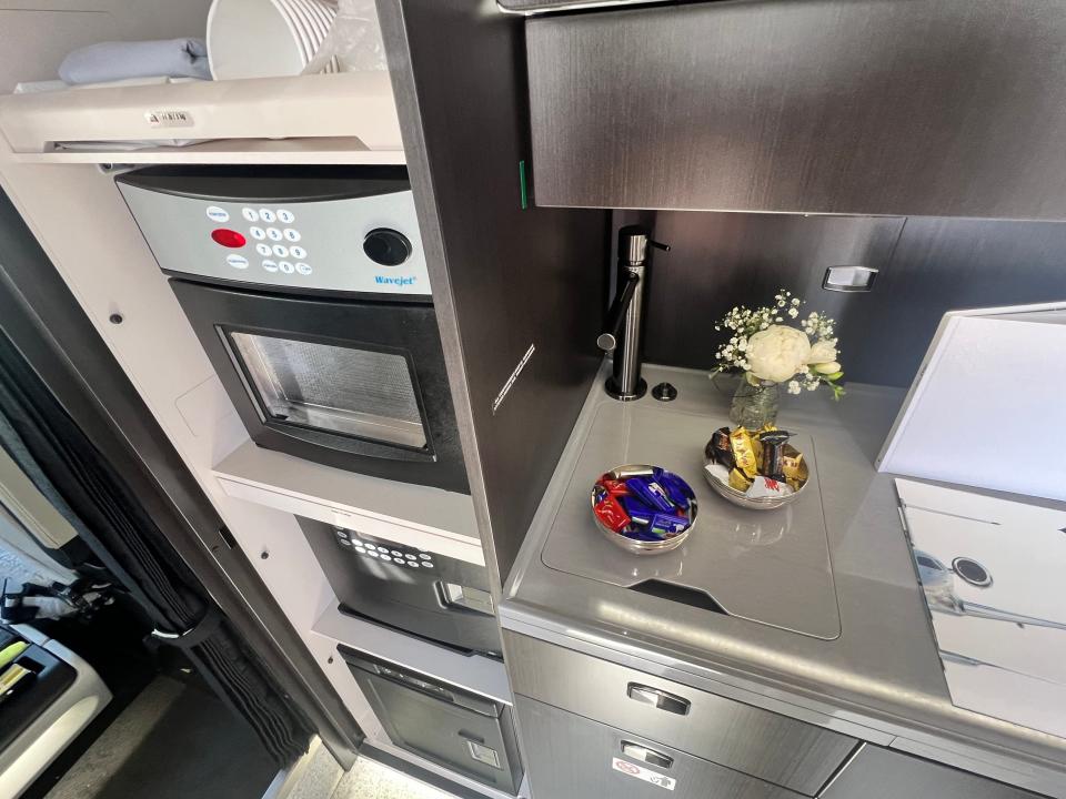 The galley of an Embraer Praetor 600 shows microwave ovens