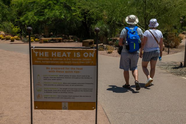 <p>Ash Ponders/Bloomberg via Getty</p> The dark pavement is retaining heat in Arizona, causing burns to residents who come into contact with it.