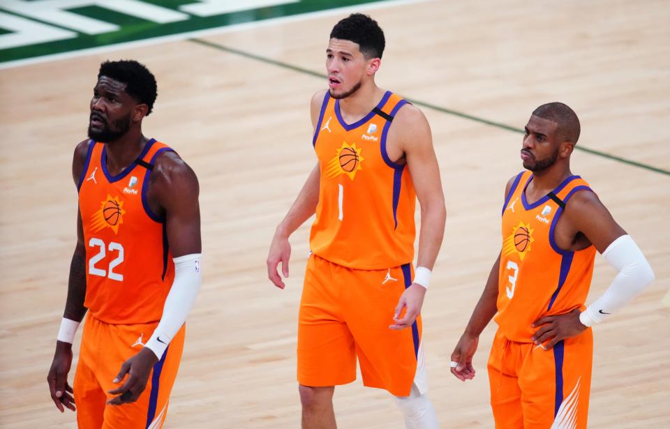 Deandre Ayton (22), Devin Booker (1) and Chris Paul (3) got a taste of playing in the NBA Finals last season. Will that help them emerge as NBA champions this season?