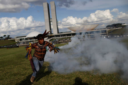 Brazilian Indians take part in a demonstration against the violation of indigenous people's rights, in Brasilia, Brazil April 25, 2017. REUTERS/Ueslei Marcelino