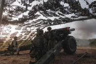 In this photo released by the Taiwan Military News Agency, a Taiwan artillery unit conducts a live firing drill to deter a coastal landing force during the Han Guang exercise held on the island of Penghu county, Taiwan, Wednesday, Sept. 15, 2021. Taiwan's annual five-day Han Guang military exercise is designed to prepare the island's forces for an attack by China, which claims Taiwan as part of its own territory. (Military News Agency via AP)