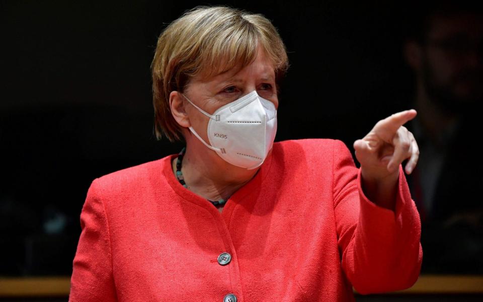 German Chancellor Angela Merkel gestures during an EU summit in Brussels on July 20, 2020, as the leaders of the European Union hold their first face-to-face summit over a post-virus economic rescue plan. (Photo by JOHN THYS / AFP) (Photo by JOHN THYS/AFP via Getty Images) - JOHN THYS/AFP