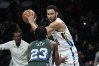 Brooklyn Nets' Ben Simmons (10) protects the ball from Detroit Pistons' Jaden Ivey (23) during the first half of an NBA basketball game Thursday, Jan. 26, 2023 in New York. (AP Photo/Frank Franklin II)