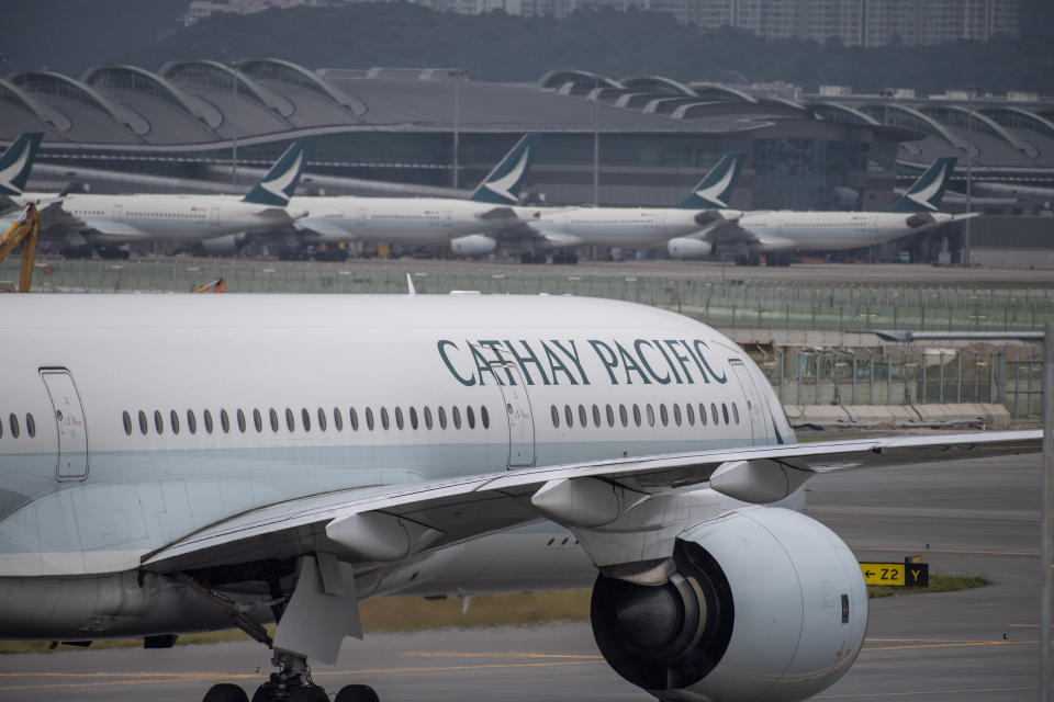 FILE - A Cathay Pacific airplane taxis at Hong Kong International Airport in Hong Kong on Nov. 25, 2022. Hong Kong will give away air tickets and vouchers to woo tourists back to the international financial hub, racing to catch up with other popular travel destinations in a fierce regional competition. (AP Photo/Vernon Yuen, File)