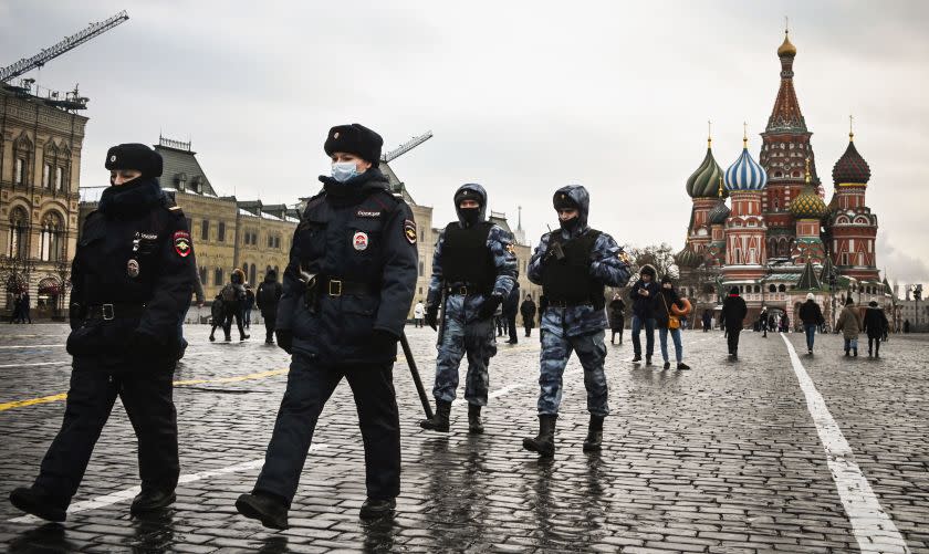 TOPSHOT - Police officers and the Russian National Guard (Rosgvardia) servicemen patrol on Red Square in central Moscow on January 25, 2021. - The Kremlin on Sunday accused the United States of interfering in Russia's domestic affairs and downplayed the scale of the weekend's protests, when tens of thousands rallied in support of jailed opposition politician Alexei Navalny. More than 3,500 demonstrators were detained in protests across the country on Saturday, with several injured in clashes with police in Moscow, following Navalny's call to rally against President Vladimir Putin's 20-year rule. (Photo by Alexander NEMENOV / AFP) (Photo by ALEXANDER NEMENOV/AFP via Getty Images)