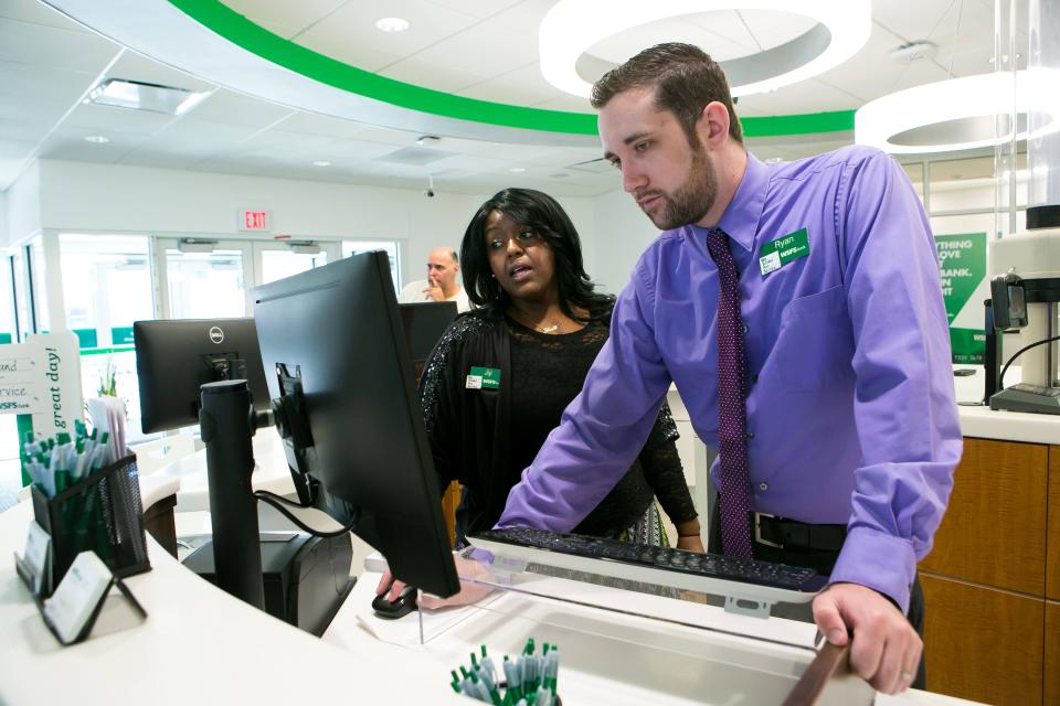 Personal Bankers Jiji Sidibay and Ryan Willard work at the WSFS Bank branch on North Union Street in Wilmington in 2017. WSFS executives emphasized how employers could chart a career at their company as they attempted to attract workers during the pandemic.