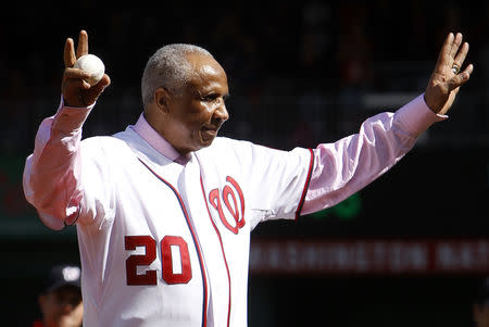 Former Washington Nationals manager Frank Robinson throws out the ceremonial first pitch before Game 3 of the MLB NLDS baseball series between the Washington Nationals and the St. Louis Cardinals in Washington October 10, 2012. REUTERS/Gary Cameron