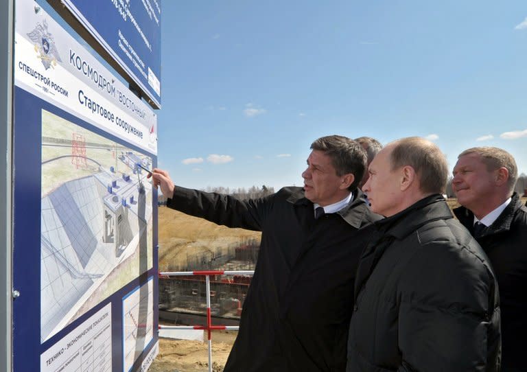 Vladimir Putin (2ndR) inspects the construction of the new Vosptochny cosmodrome in the Amur Region, on April 12, 2013. The Russia president unveiled a new $50 billion drive for Russia to preserve its status as a top space power, including the construction of a brand new cosmodrome from where humans will fly to space by the end of the decade