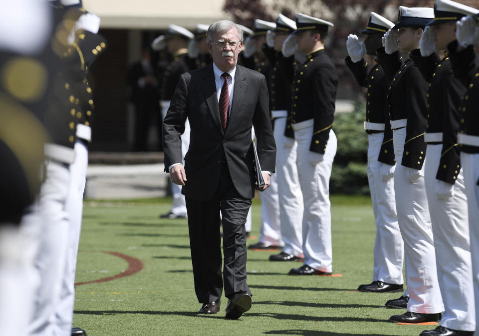 National Security Adviser John Bolton is saluted as he arrives to speak at the commencement for the United States Coast Guard Academy in New London, Conn., Wednesday, May 22, 2019. (AP Photo/Jessica Hill)