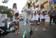 Mercedes Formula One driver Nico Rosberg of Germany poses with champagne after winning the Monaco Grand Prix in Monaco May 25, 2014. REUTERS/Max Rossi (MONACO - Tags: SPORT MOTORSPORT F1)