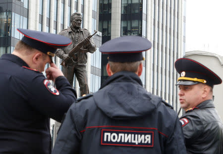 Police officers guard during the opening ceremony of a monument to Mikhail Kalashnikov, the Russian designer of the AK-47 assault rifle, in Moscow, Russia September 19, 2017. REUTERS/Sergei Karpukhin