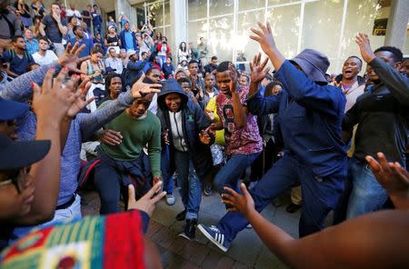 University of Cape Town (UCT) students sing during protests demanding free tertiary education in Cape Town. REUTERS/Mike Hutchings