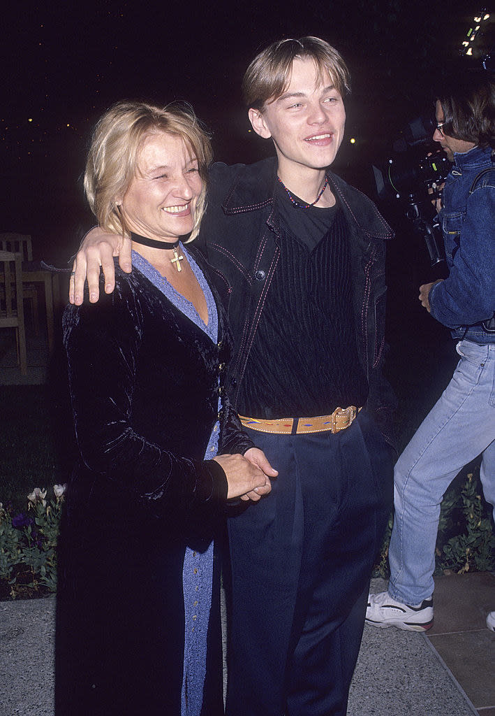 Leo with his arm around his mom's shoulders