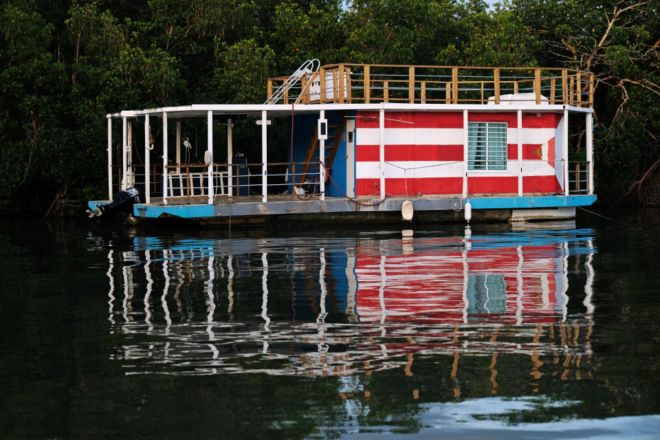 A house boat is seen secured to a mangrove as Tropical Storm Dorian approaches Cabo Rojo, Puerto Rico on Aug. 27, 2019.  (Photo: Ricardo Arduengo/Reuters)