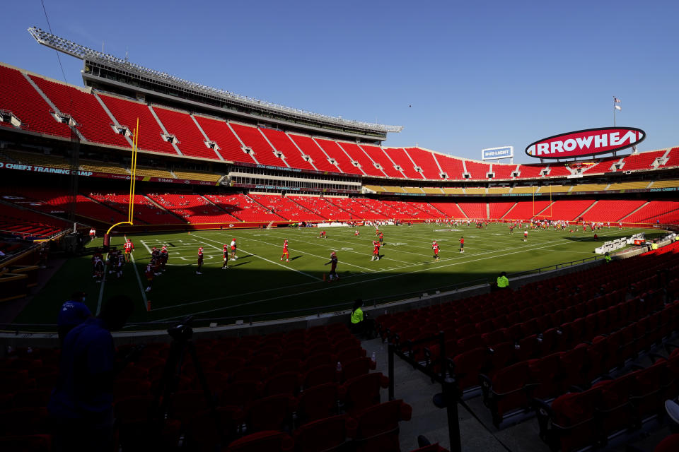 Socially distanced fans watch the Kansas City Chiefs during an NFL football training camp Saturday, Aug. 22, 2020, at Arrowhead Stadium in Kansas City, Mo. The Chiefs opened the stadium to 2,000 season ticket holders to watch practice as the team plans to open the regular season with a reduced capacity of approximately 22 percent or normal. (AP Photo/Charlie Riedel)