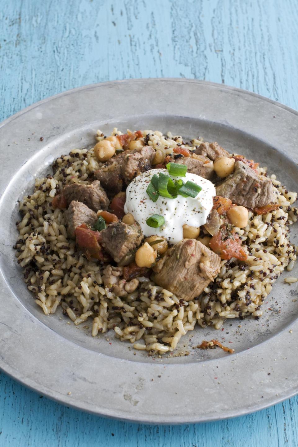 In this image taken on March 18, 2013, rosemary lamb tagine with chickpeas and tomatoes is shown served on a plate in Concord, N.H. (AP Photo/Matthew Mead)