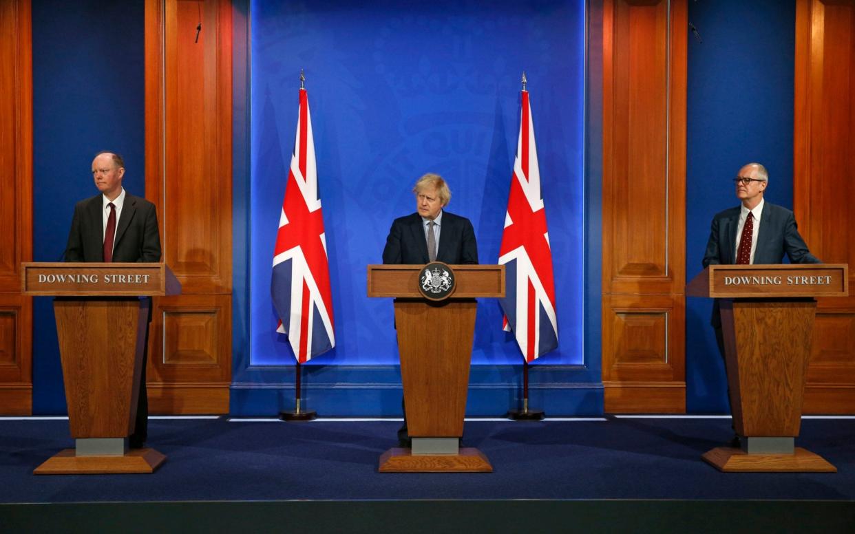 Britain's Prime Minister Boris Johnson, Chief Medical Officer Professor Chris Whitty, left, and Chief scientific adviser Patrick Vallance, - Hollie Adams /AFP