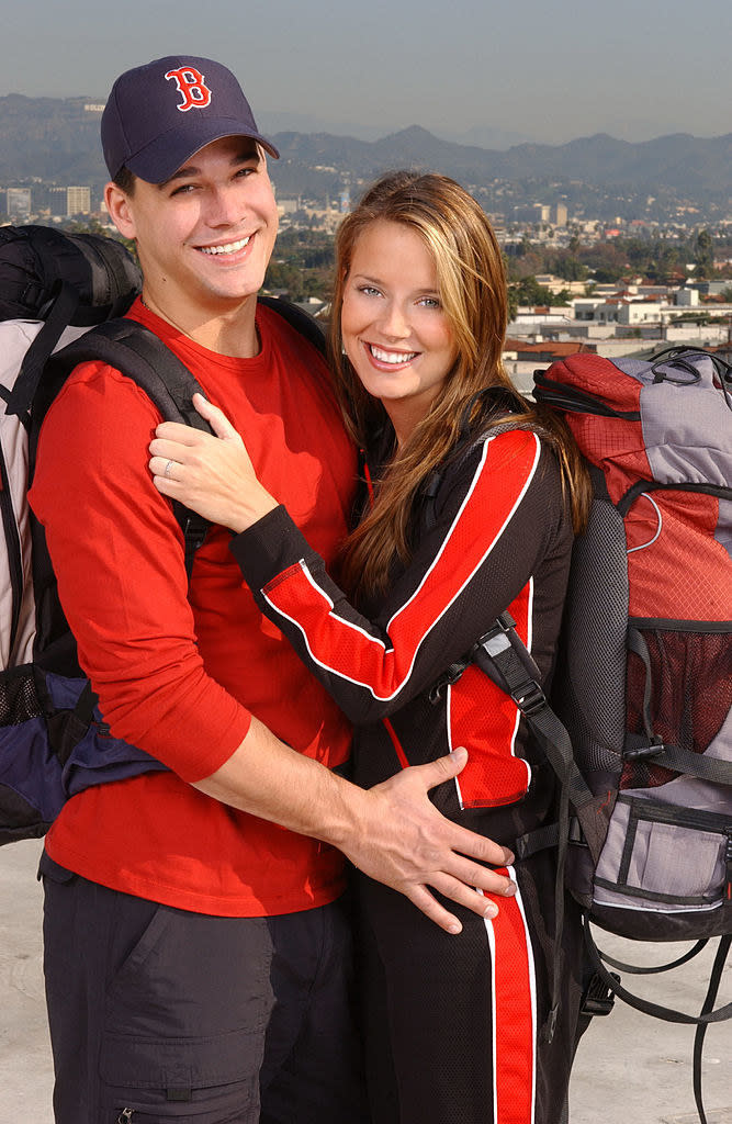 the couple poses on amazing race