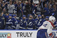The Tampa Bay Lightning bench erupts after defeating the Montreal Canadiens to win the Stanley Cup in Game 5 of the NHL hockey finals, Wednesday, July 7, 2021, in Tampa, Fla. (AP Photo/Phelan Ebenhack)