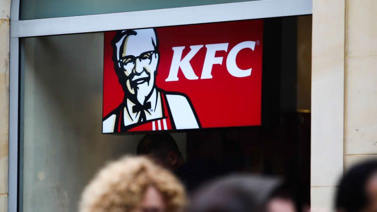 A KFC sign seen through a window.
