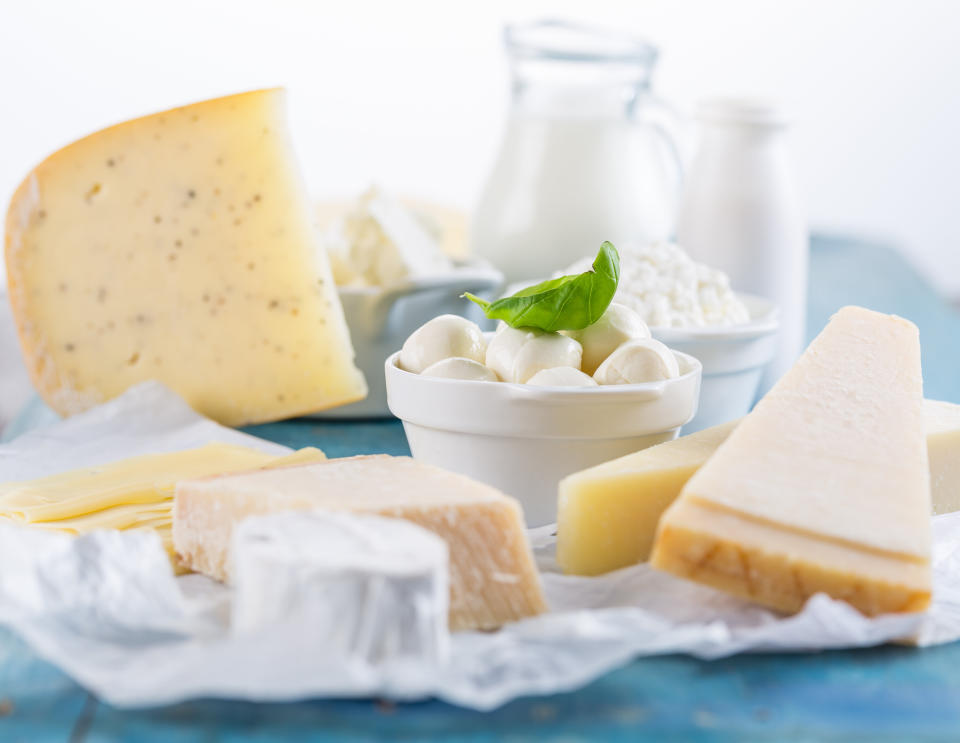 Different types of dairy products on wooden background