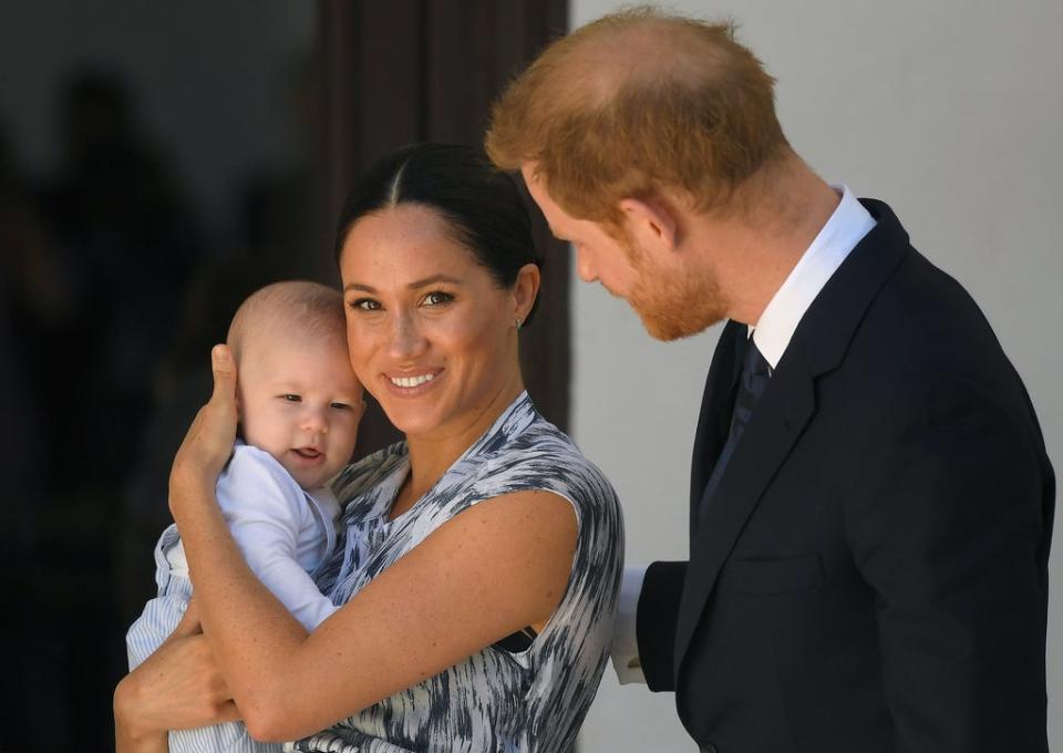 The Duchess of Sussex with her son Archie and husband Harry (PA Wire)