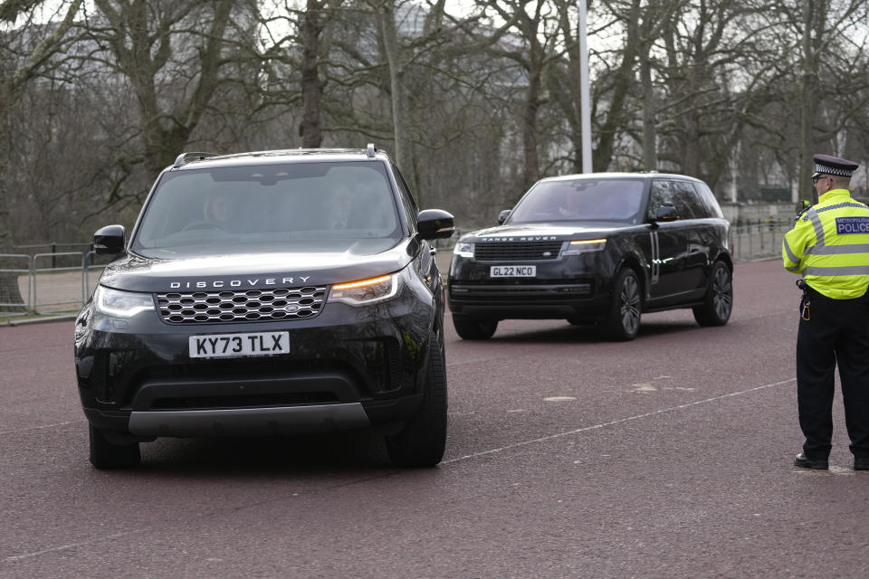 A convoy of cars believed to be carrying Prince Harry arrive at Clarence House following the announcement of King Charles III's cancer diagnosis, in London, Tuesday, Feb. 6, 2024. Buckingham Palace announced Monday evening that the king has begun outpatient treatment for an undisclosed form of cancer. (AP Photo/Kin Cheung)