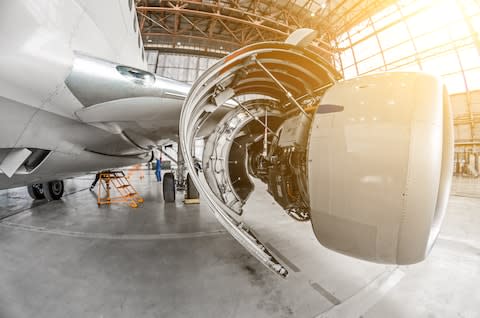 A plane siitting in a hangar - Credit: AP