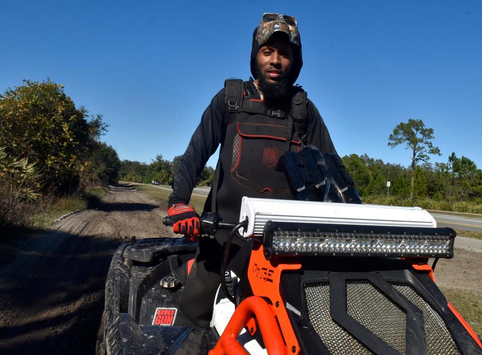 Marquie Cloud on his ATV in the Port St. John area. He loves the freedom of riding, and says that everyone gets along, with no race issues.