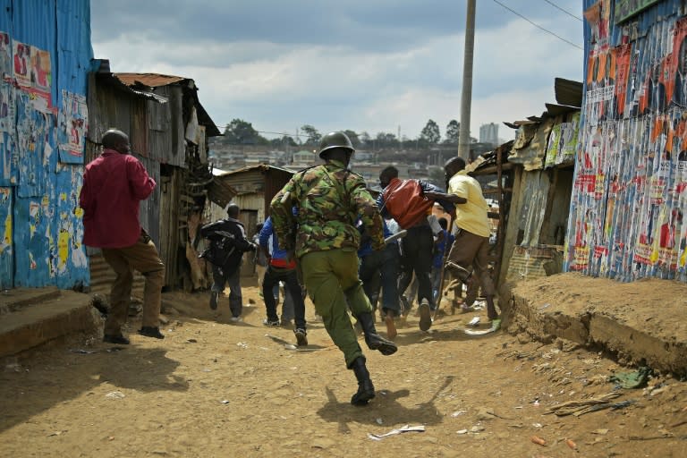 Kenyan security forces patrol the Nairobi slum of Mathare after protests by supporters of opposition Raila Odinga who claims last week's election was rigged