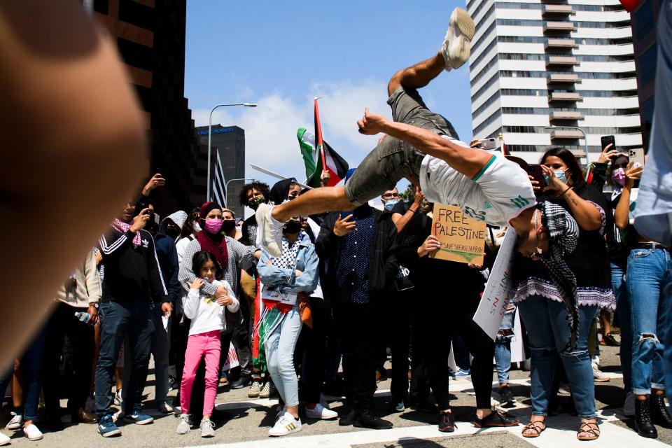 A demonstrator performs a backflip outside the Consulate of Israel during a pro-Palestinian demonstration May 15 in Los Angeles.