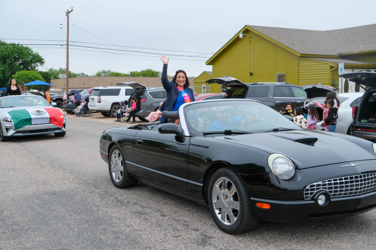 The Grand Marshall waves at the crowd at the annual Cinco de Mayo Parade Saturday down Arthur Street in Amarillo.