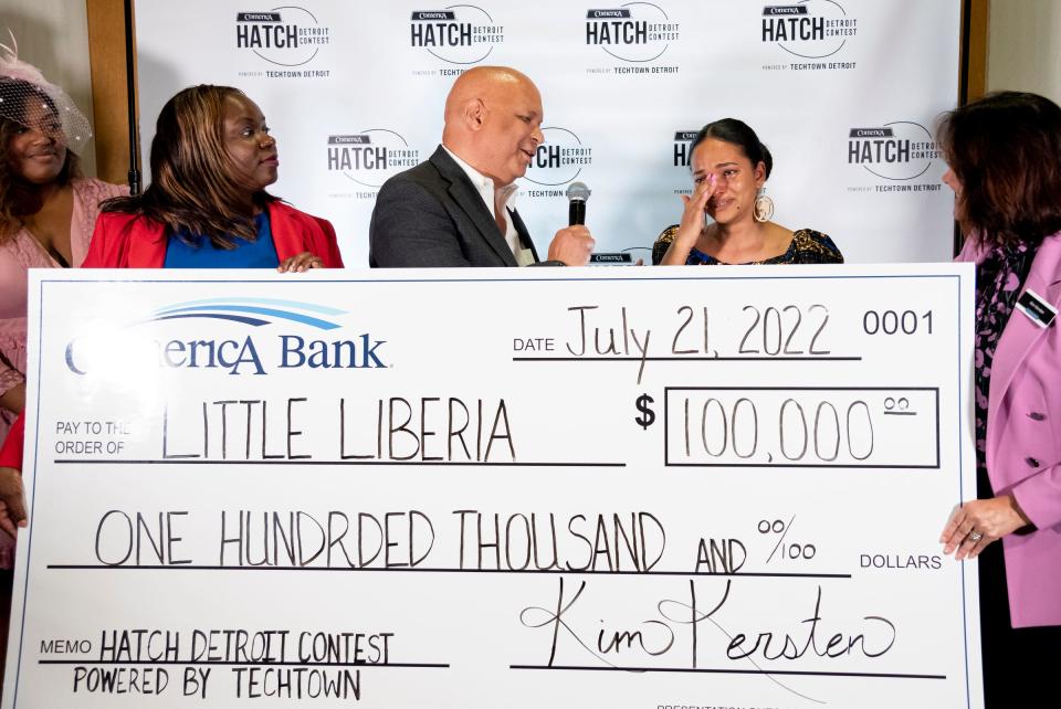 Little Liberia owner Ameneh Marhaba's gets emotional at the grand prize check presentation after winning the Hatch Detroit's pitch competition at the Wayne State University Industry Innovation Center on July 21, 2022. "I owe a lot of where I'm at now to my father because of his sacrifice that he did to get us here," says Marhaba.