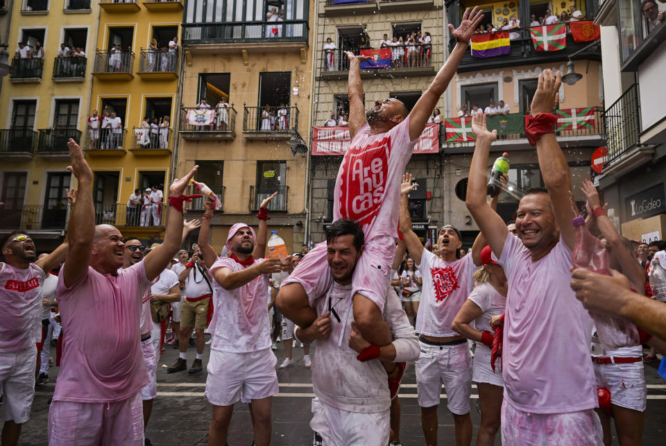 Revellers gather for the 'Chupinazo' rocket, which marks the official opening of the 2023 San Fermín fiestas in Pamplona, Spain, Thursday, July 6, 2023. (AP Photo/Alvaro Barrientos)