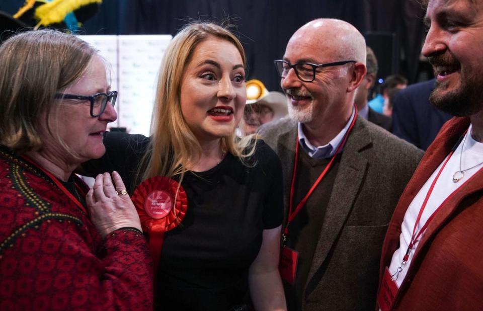 Labour Party candidate Gen Kitchen celebrates with her family after being declared winner in the Wellingborough by-election (PA)