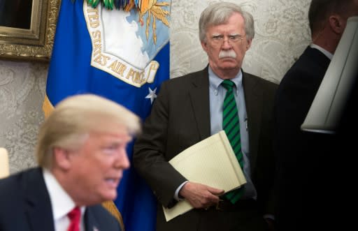 National Security Adviser John Bolton stands alongside US President Donald Trump as he speaks about the prospects for the summit with North Korea going ahead -- a meeting put in doubt when Pyongyang bristled at comments made by Bolton