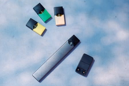 A Juul e-cigarette and pods are seen in this picture illustration