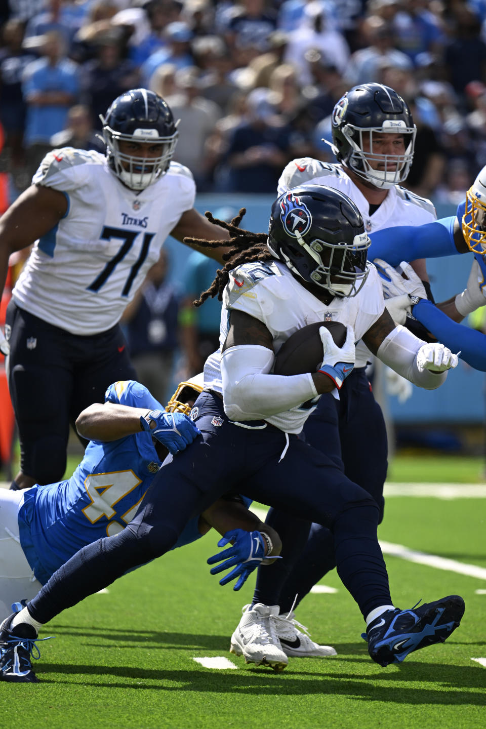 Tennessee Titans running back Derrick Henry carries against the Los Angeles Chargers during the second half of an NFL football game Sunday, Sept. 17, 2023, in Nashville, Tenn. (AP Photo/John Amis)