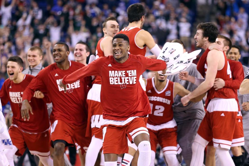 The Wisconsin Badgers celebrate after defeating the Kentucky Wildcats during the NCAA Men's Final Four Semifinal at Lucas Oil Stadium on April 4, 2015 in Indianapolis, Indiana.