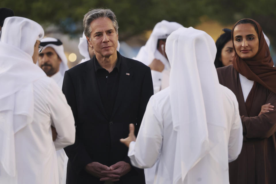 U.S. Secretary of State Anthony Blinken, left, and Vice Chairperson and CEO of Qatar Foundation, Sheikha Hind bint Hamad al-Thani, right, listen to officials during a visit to Oxygen Park at Education City, in Doha Qatar, Monday, Nov. 21, 2022. (Karim Jaafar/Pool via AP)