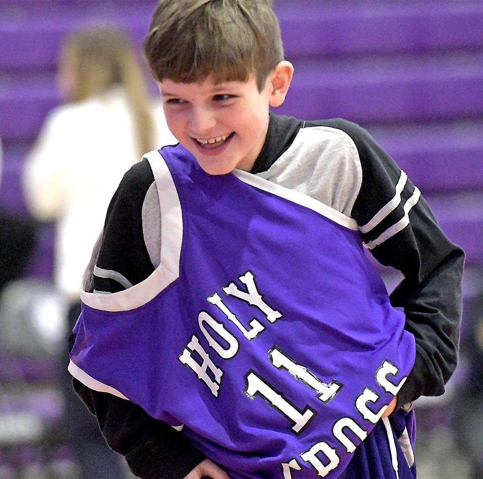 Although the jersey got a little twisted, Davis Darling, 10, of Sutton won the entertaining Jersey Race at halftime of the Holy Cross/Bucknell game.