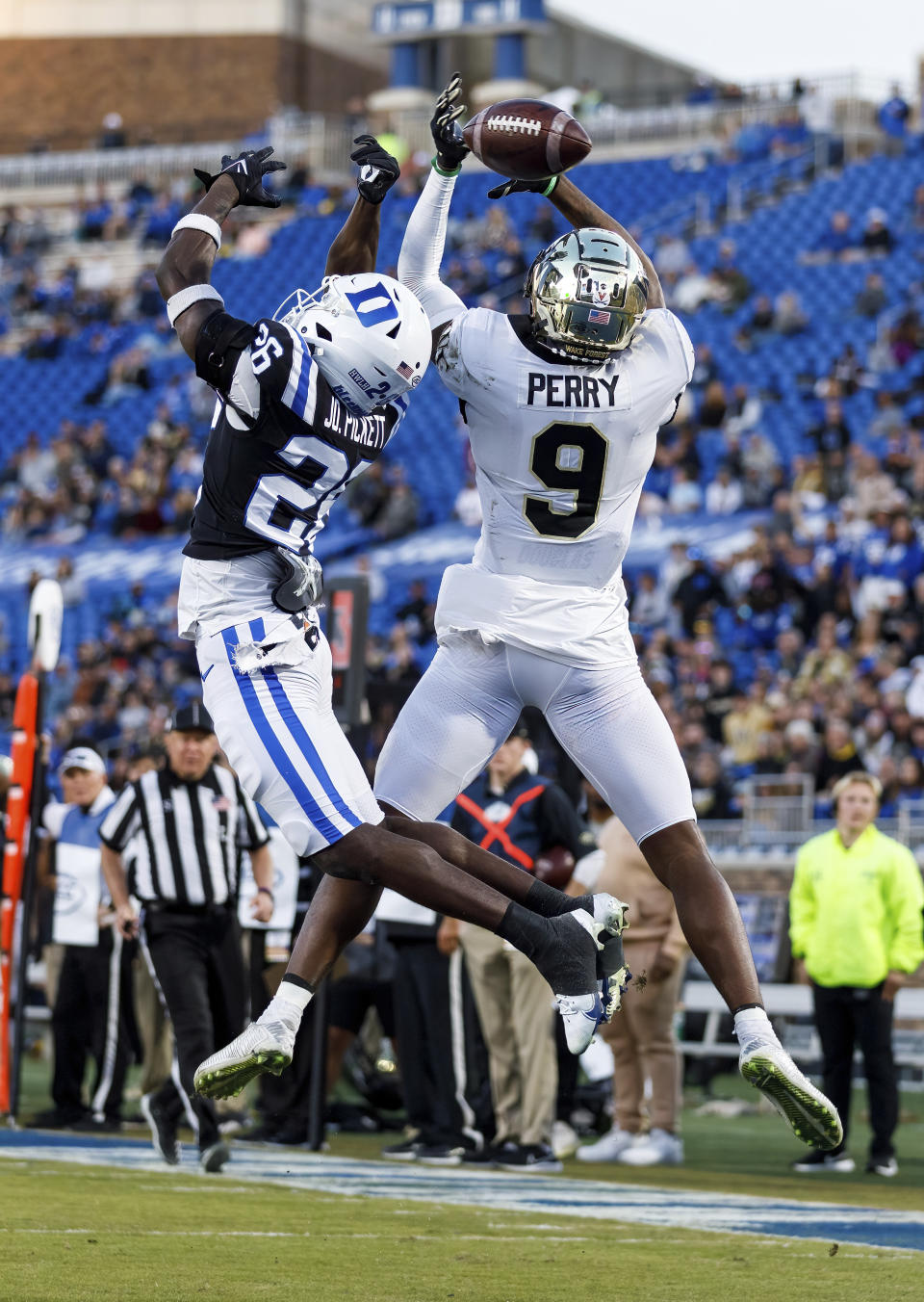 A pass intended for Wake Forest's A.T. Perry (9) flies incomplete as Duke's Joshua Pickett defends during the first half of an NCAA college football game in Durham, N.C., Saturday, Nov. 26, 2022. (AP Photo/Ben McKeown)