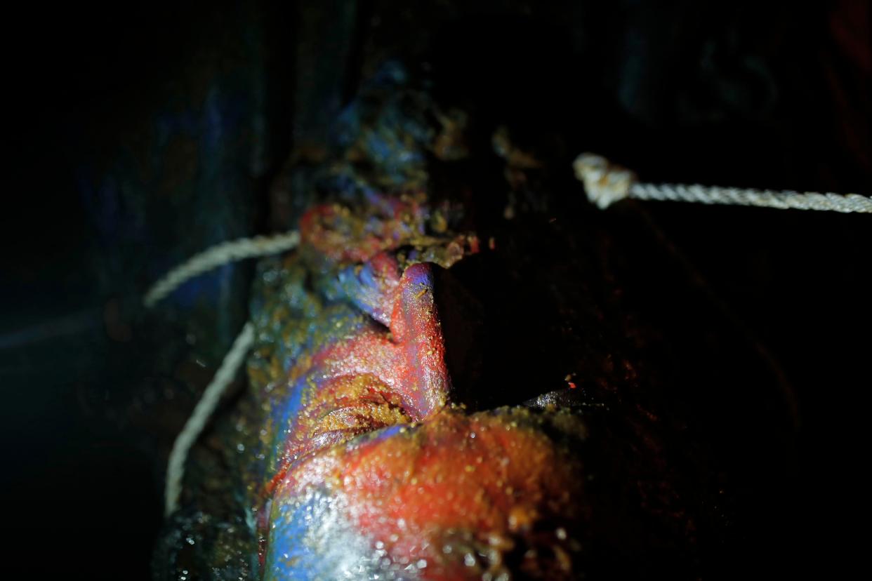 The head part of the statue of a Confederate general Albert Pike, in the nation's capital, lies on the ground after it was toppled by protesters and set on fire in Washington, D.C. early Saturday, June 20, 2020.