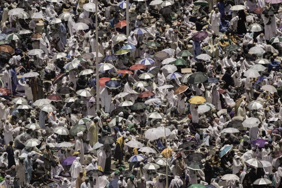 Thousands of Muslim pilgrims hold umbrellas to protect themselves from the sunny weather, as they offer Friday prayers outside the Grand Mosque, during the annual hajj pilgrimage, in Mecca, Saudi Arabia, Friday, June 23, 2023. Muslim pilgrims are converging on Saudi Arabia's holy city of Mecca for the largest hajj since the coronavirus pandemic severely curtailed access to one of Islam's five pillars. (AP Photo/Amr Nabil)