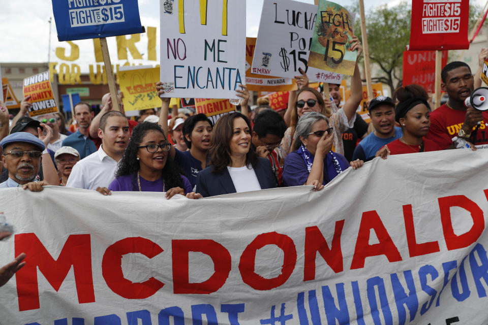 Democratic presidential candidate Sen. Kamala Harris, center, D-Calif., marches with people protesting for higher minimum wage outside of McDonald's, Friday, June 14, 2019, in Las Vegas. (AP Photo/John Locher)