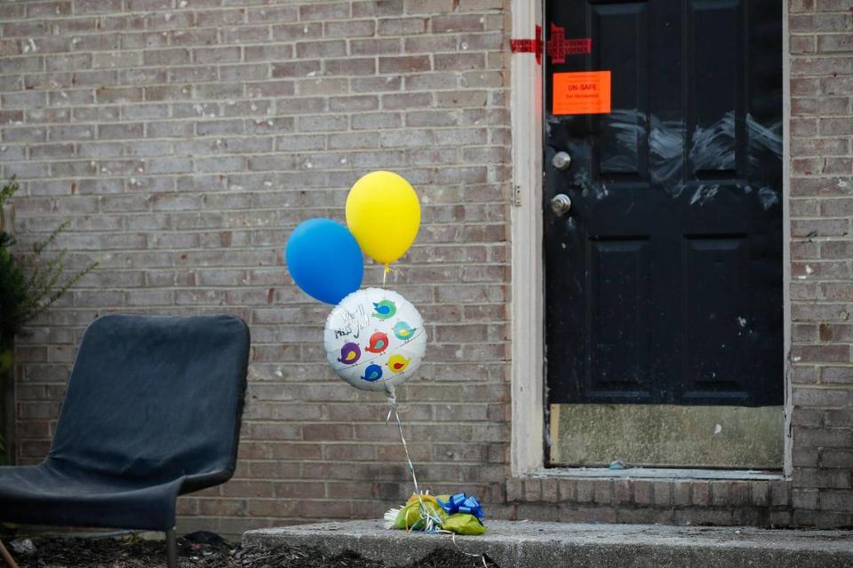 Balloons sat outside an apartment building on Keystone Drive in Richmond Wednesday, one day after Christopher and Gracie Hager were shot to death. Thomas C. Birl was charged.