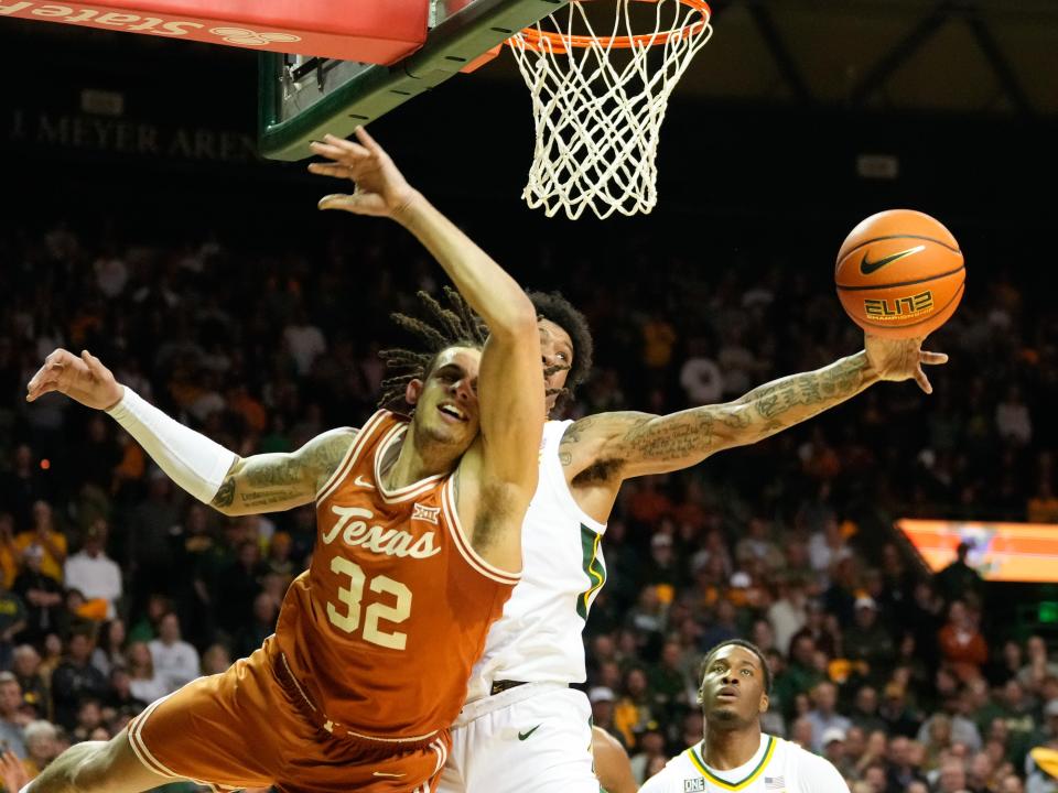 Texas forward Christian Bishop's shot is blocked by Baylor's Jalen Bridges in Saturday's 81-72 loss to the Bears in Waco. It was a costly blow for the Longhorns' Big 12 regular-season title hopes.