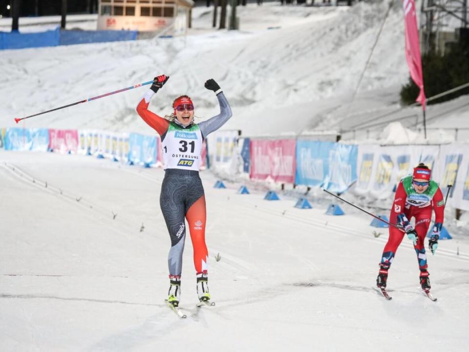 Canada's Natalie Wilkie, left, held off Norway's Vilde Nilsen, right, to win her first Para-nordic world championship title in cross-country skiing with a victory in the women's standing skate-ski sprint race on Tuesday in Östersund, Sweden. (Parasport Sweden - image credit)