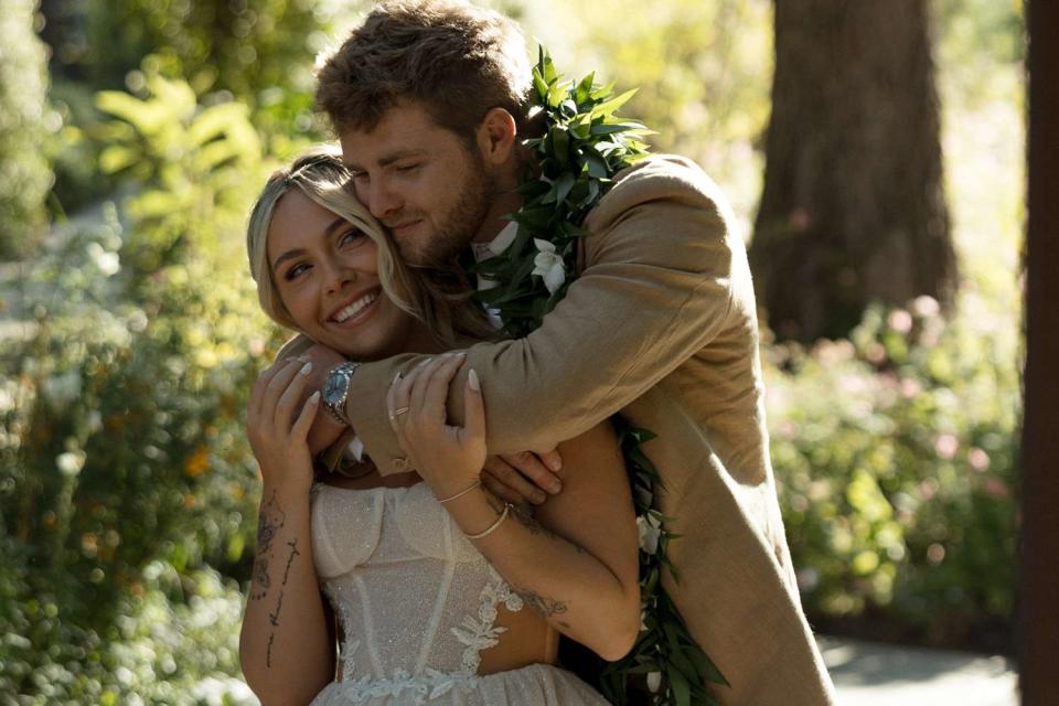 <p>AP Imagery, Andreana Peterson</p> Hype House alums Alex Warren and Kouvr Annon at their wedding at the Ethereal Gardens in Escondido, Calif., June 22.