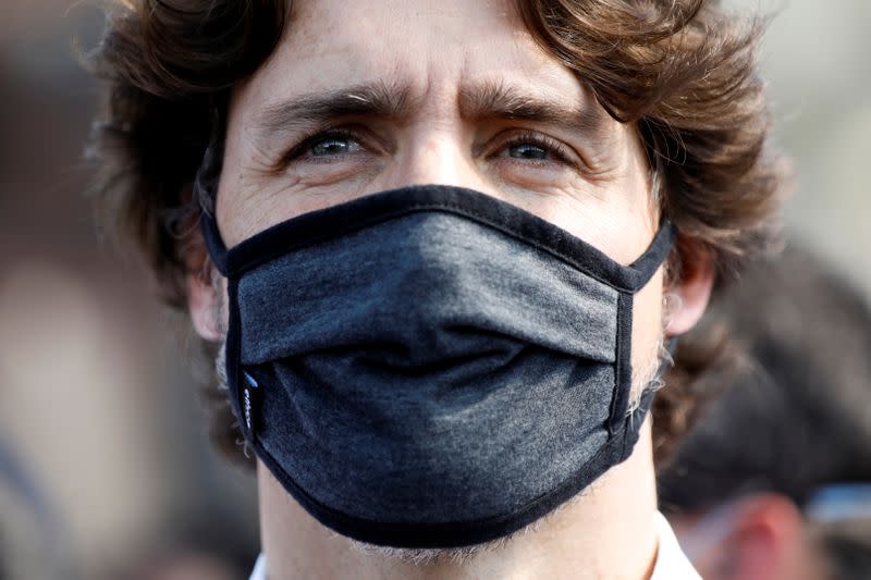 Canada's Prime Minister Justin Trudeau wears a mask as he takes part in a rally against the death in Minneapolis police custody of George Floyd, on Parliament Hill, in Ottawa